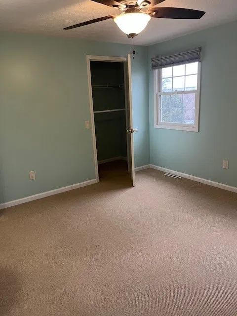 Bedroom #2 is good size with wall-to-wall carpeting, center light and fan and boasts a huge clothes closet!!