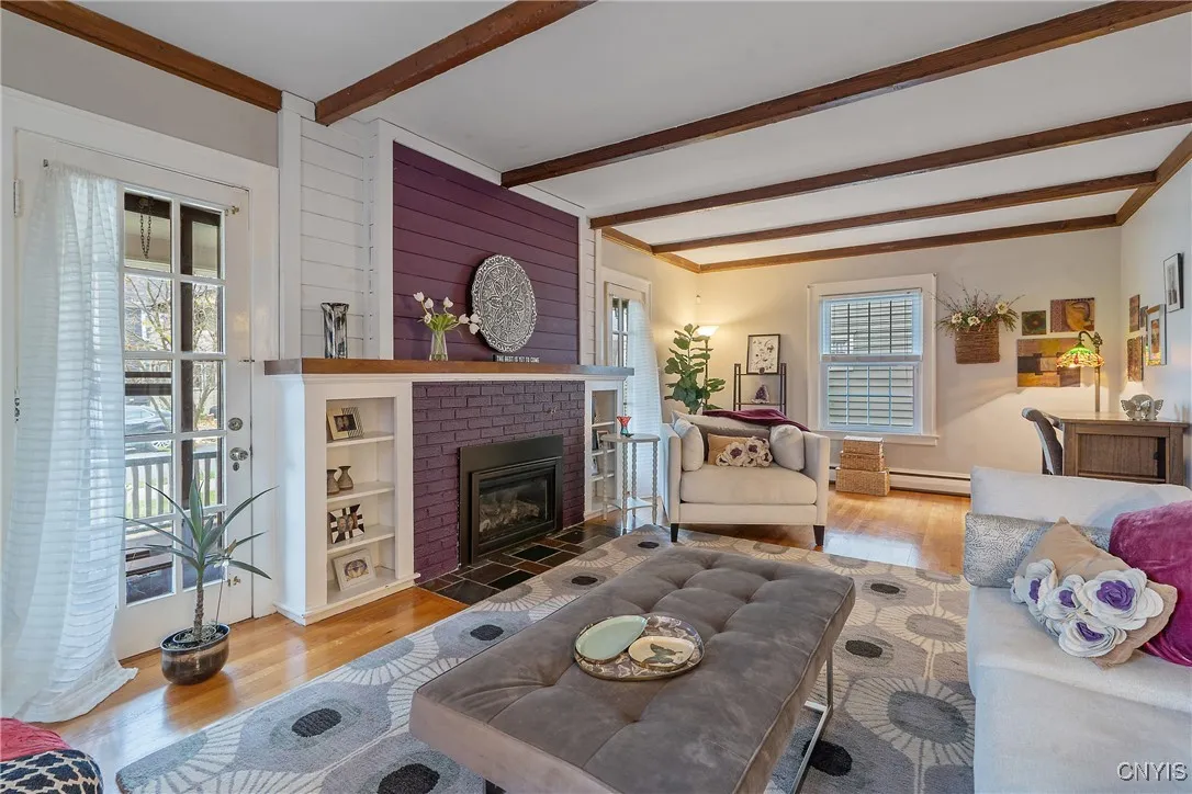 The view from the south end of the room shows just how sprawling this room is!  Lots of space for a separate seating area and desk at the north end, without encroaching on the living space at all.  And before we continue through the home, let's step out through the glass doors onto the porch.