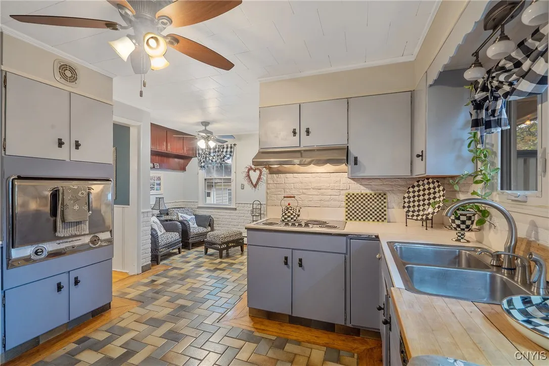Just look at how long this room is! Loads of prep space on the countertops as well as all the storage in the abundant cabinet space.