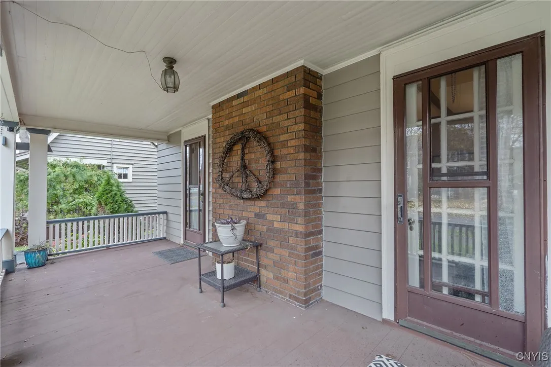 The porch does not step down to the yard, so this porch party is by invite only! The backside of the fireplace brings that marvelous brick to the porch as well.