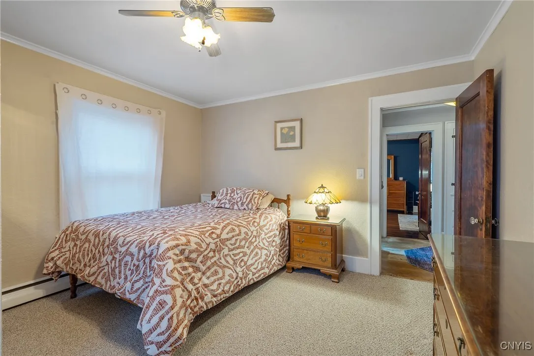 This room is carpeted, but if your preference is hardwoods, you will be happy to know they are under here, just like the rest of the house. And enjoy the clean efficiency of the hot water baseboard heating system.