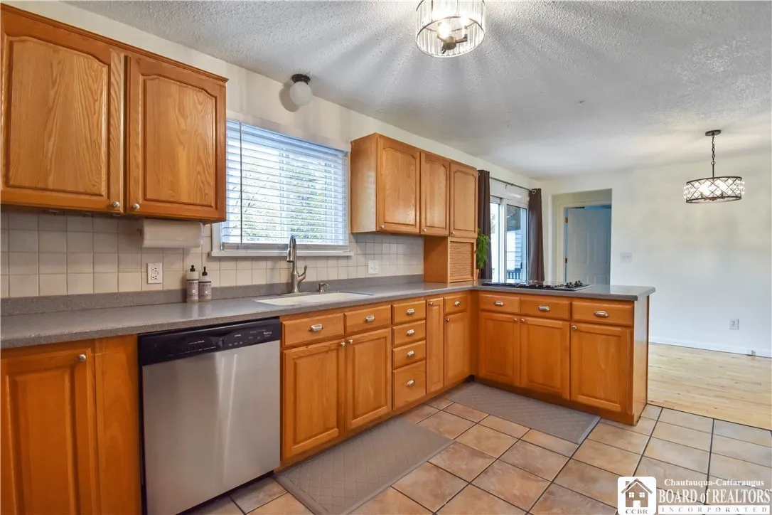 Solid surface counters and cooktop in kitchen