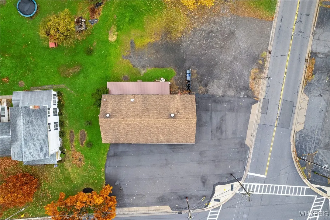 .35 ACRE vacant lot is behind auto shop (100' frontage) see attached survey