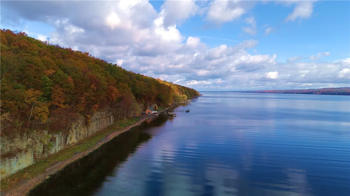 The contrast of rich fall color against the lake’s clear depth makes the setting stand out — classic west-side Seneca: dramatic, peaceful, and unmistakably Finger Lakes.