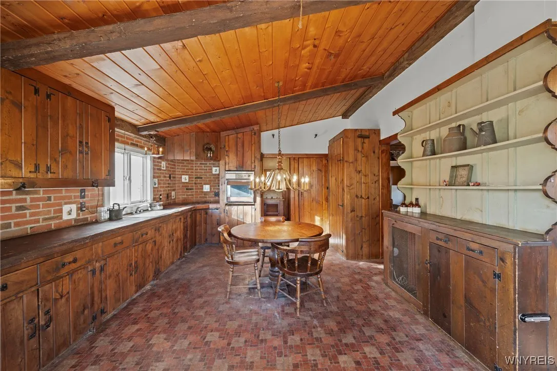 kitchen with large built in hutch and walk in pantry area