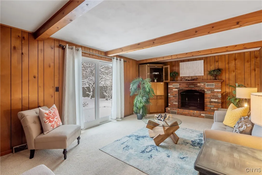 Lovely family room with brick, woodburning fieplace