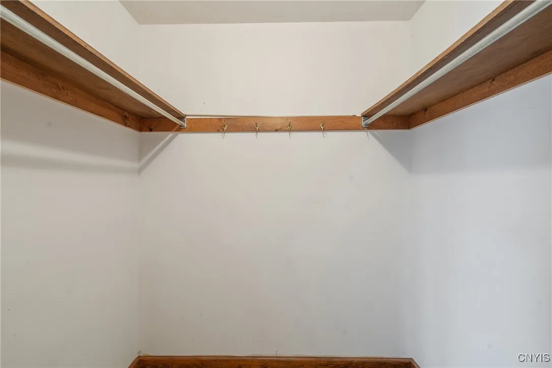 Primary bedroom walk in closet
