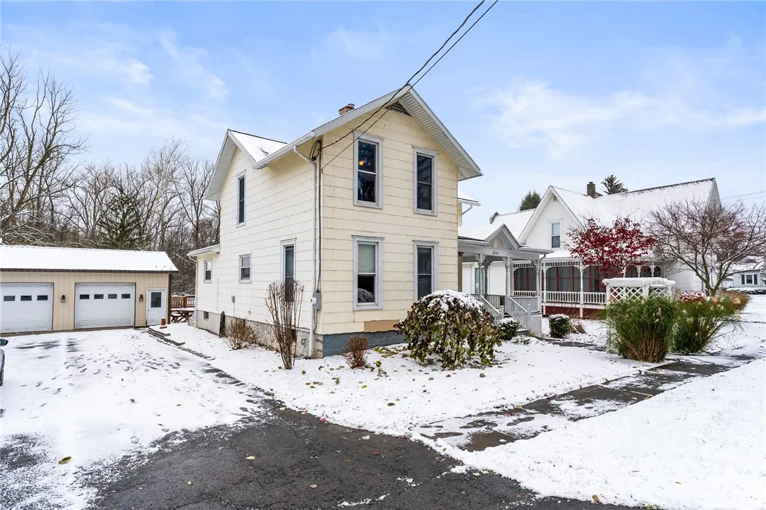 LEFT SIDE OF HOME/DRIVEWAY