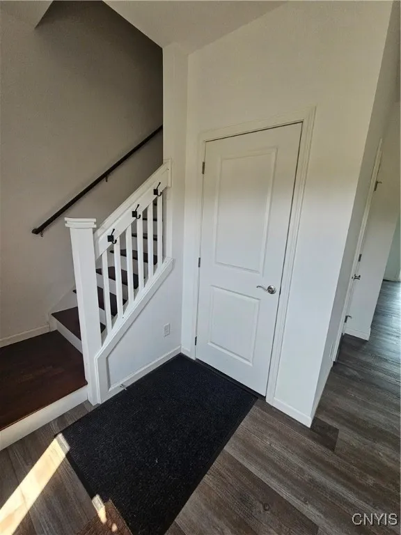 front entrance closet and stairs to 2nd story