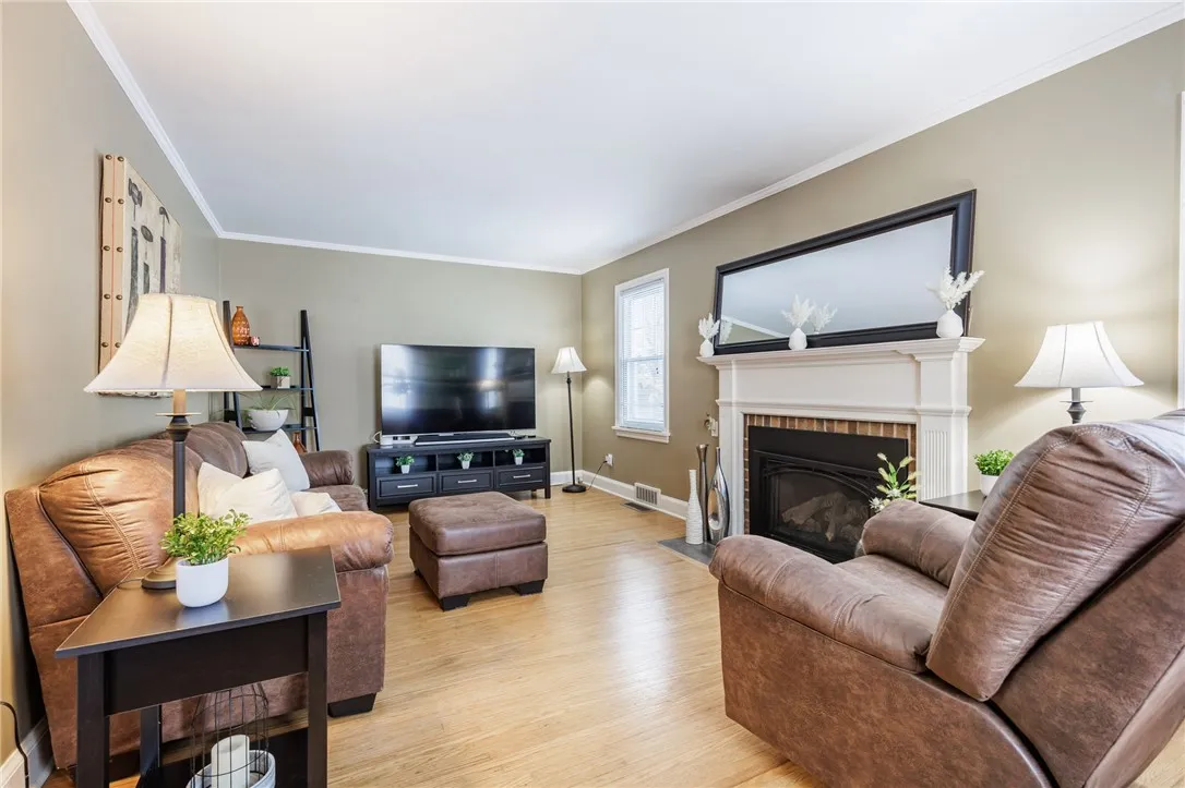 Living room features gas fireplace.