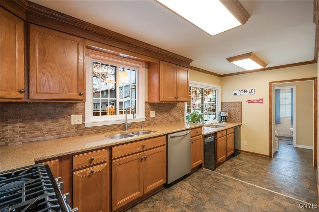 Leads to convenient half bath, garage entry and one of the backyard access points.