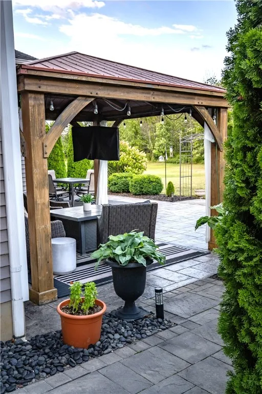 Side view to your private Stamped Concrete Patio and Gazebo