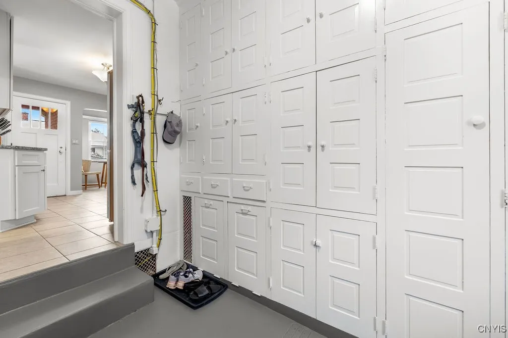 The utility room is located off the kitchen, as is the laundry, storage, and entrance to and from the garage. The sellers just had this room painted.