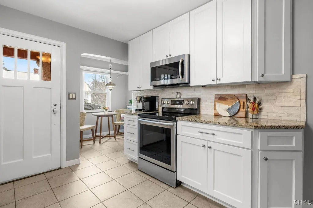 What an adorable eat in nook that seats two comfortably. The door takes you to the side entrance.