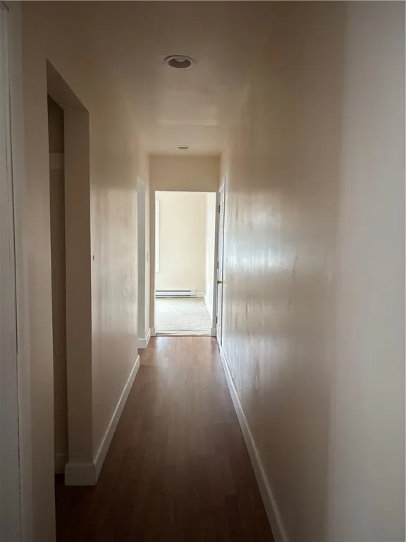 Hallway leads to bedrooms, kitchen & living room is straight ahead