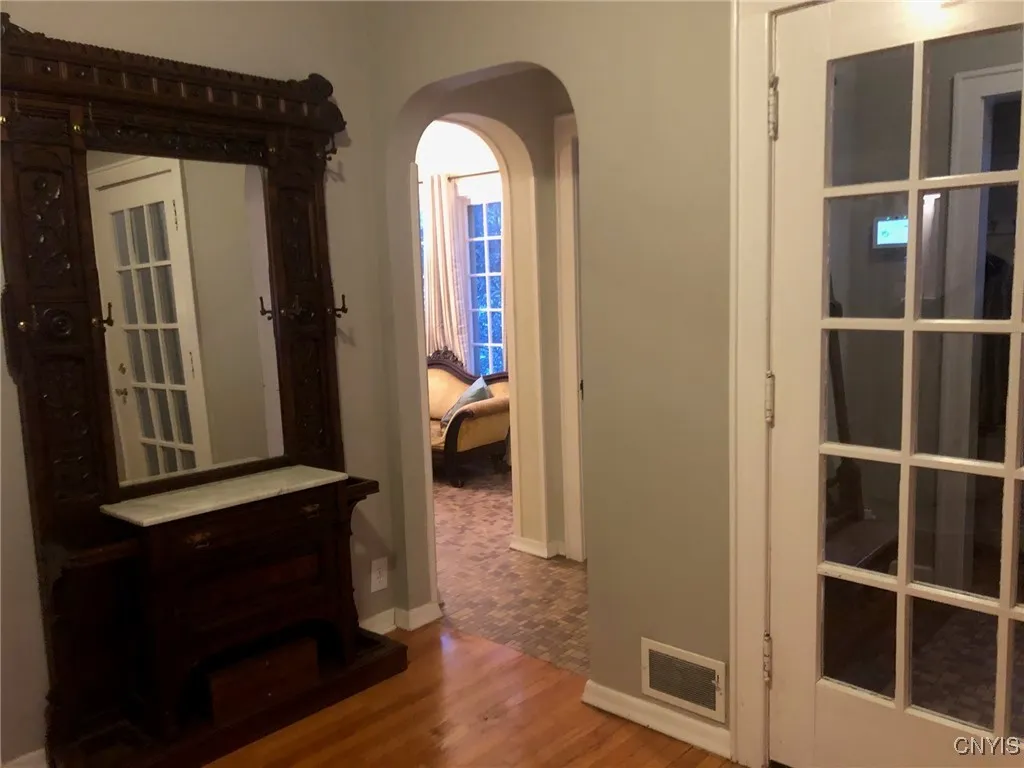 turn right and note the powder room and the Sun/sitting room