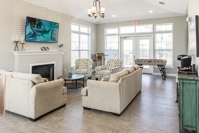 Green Wood Community Room with seating area, kitchenette, and foosball table