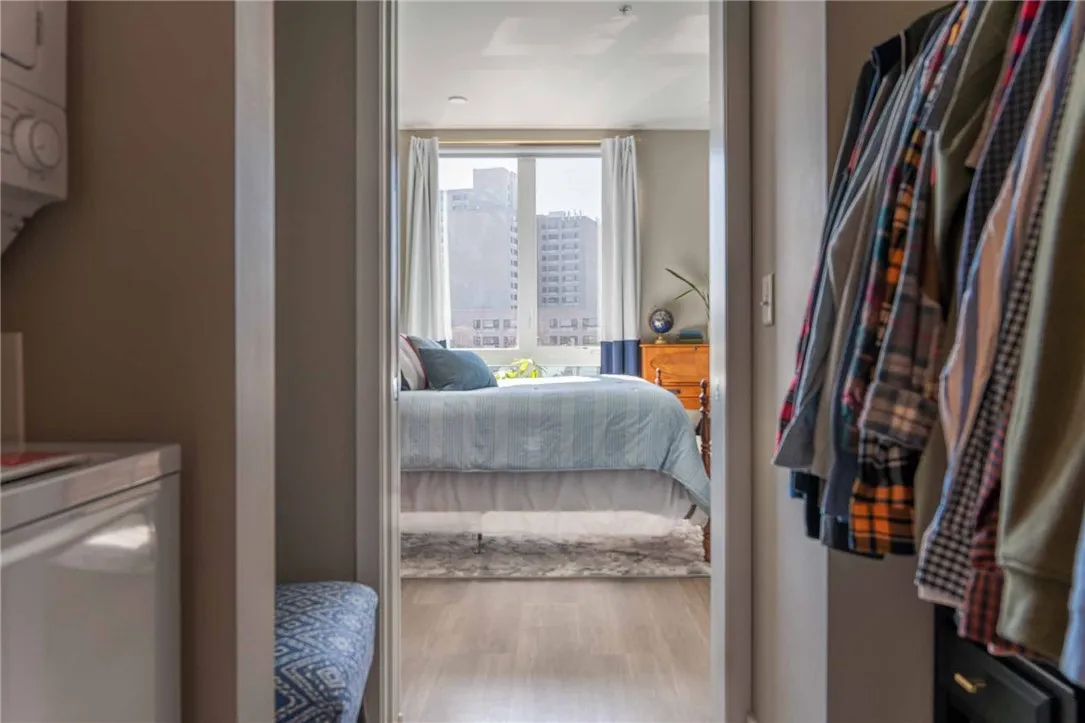 Typical walk-in closet with stacked washer/dryer