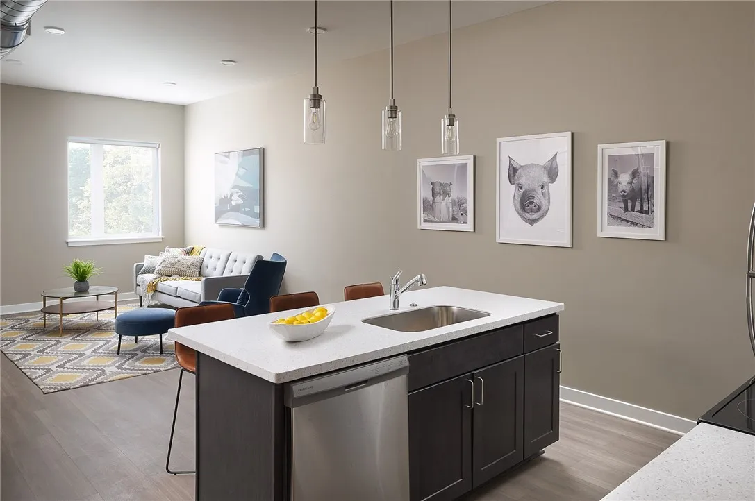 Typical Great Room with living area, dining area, and kitchen with island/breakfast bar