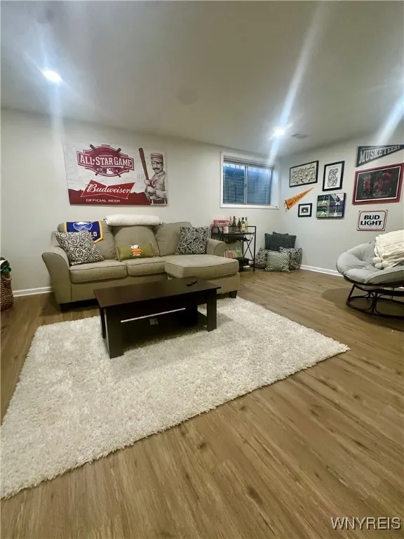 Large finished room in basement with egress window.