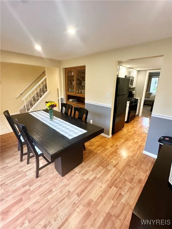 Dining rm has built in, lighted cabinet.