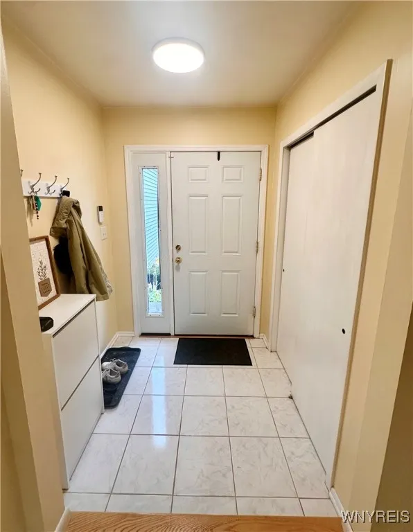 Spacious entryway with double closet.