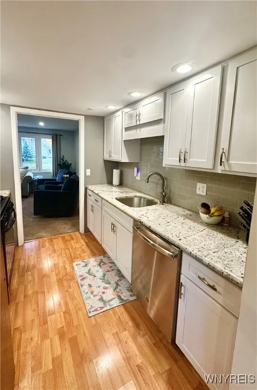Stainless steel dishwasher and sink.
