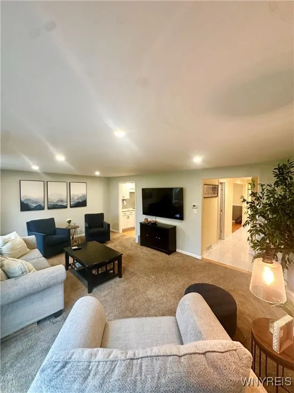 Living room also opens to both kitchen and entrance hall.