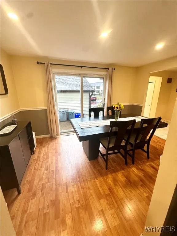 Sliding door from dining area to front patio.
