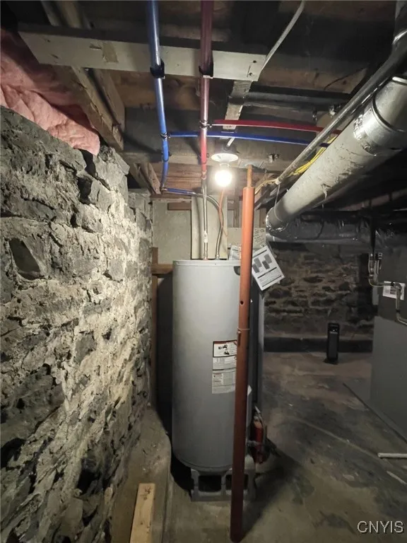 Basement view of west foundation wall and water heater