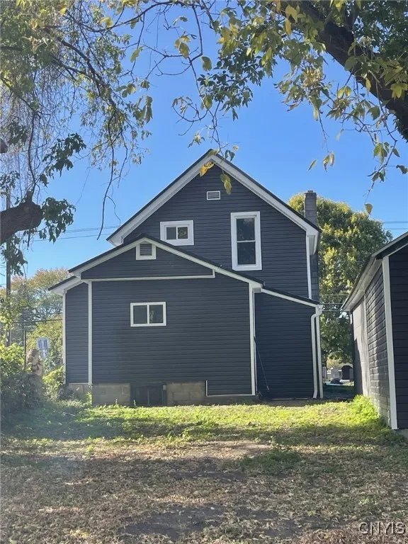 Back yard view of house; potential private patio area.