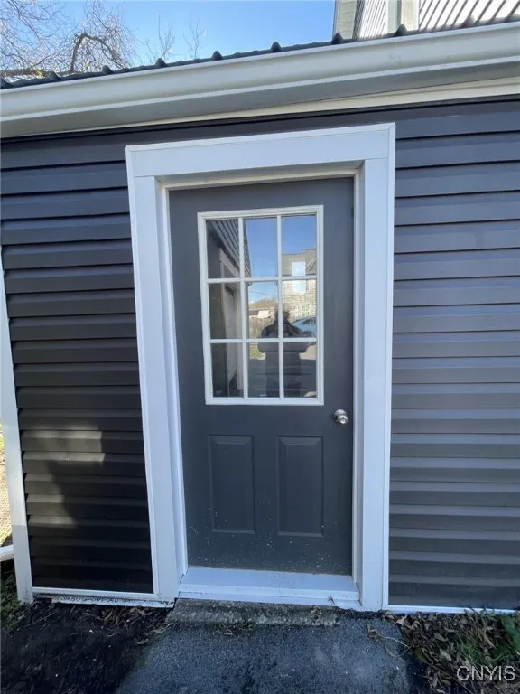 Side Entry Exterior door near garage and parking area.