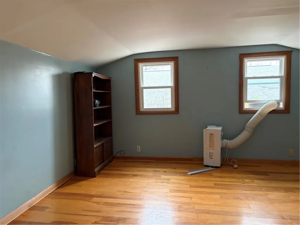 Large upstairs bedroom with 2 storage areas on each side
