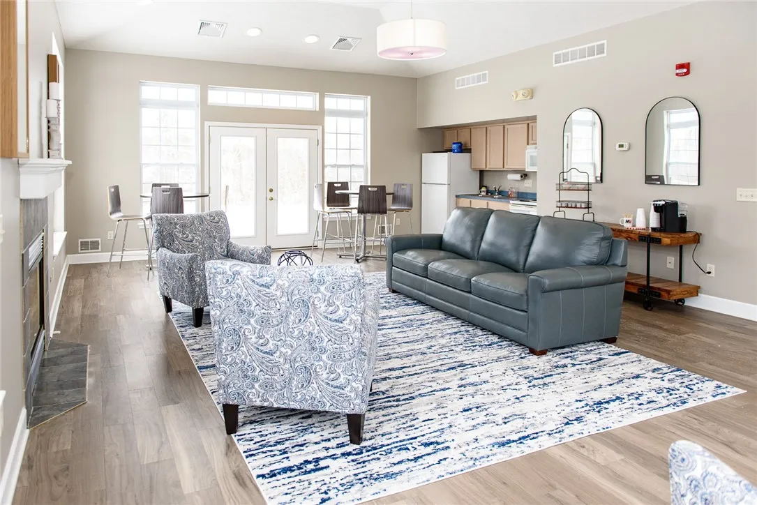 View of Resident Clubhouse/Community Room with view of kitchenette in background