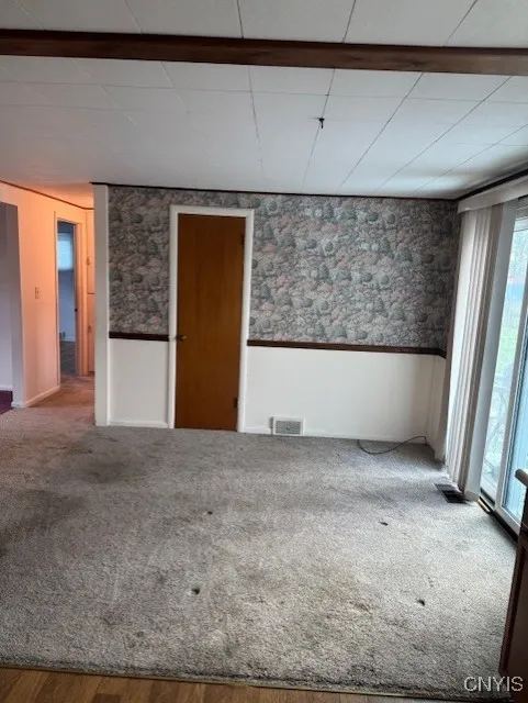 DINING AREA. DOOR AHEAD CAN BE A PANTRY. HARDWOODS UNDER CARPET.