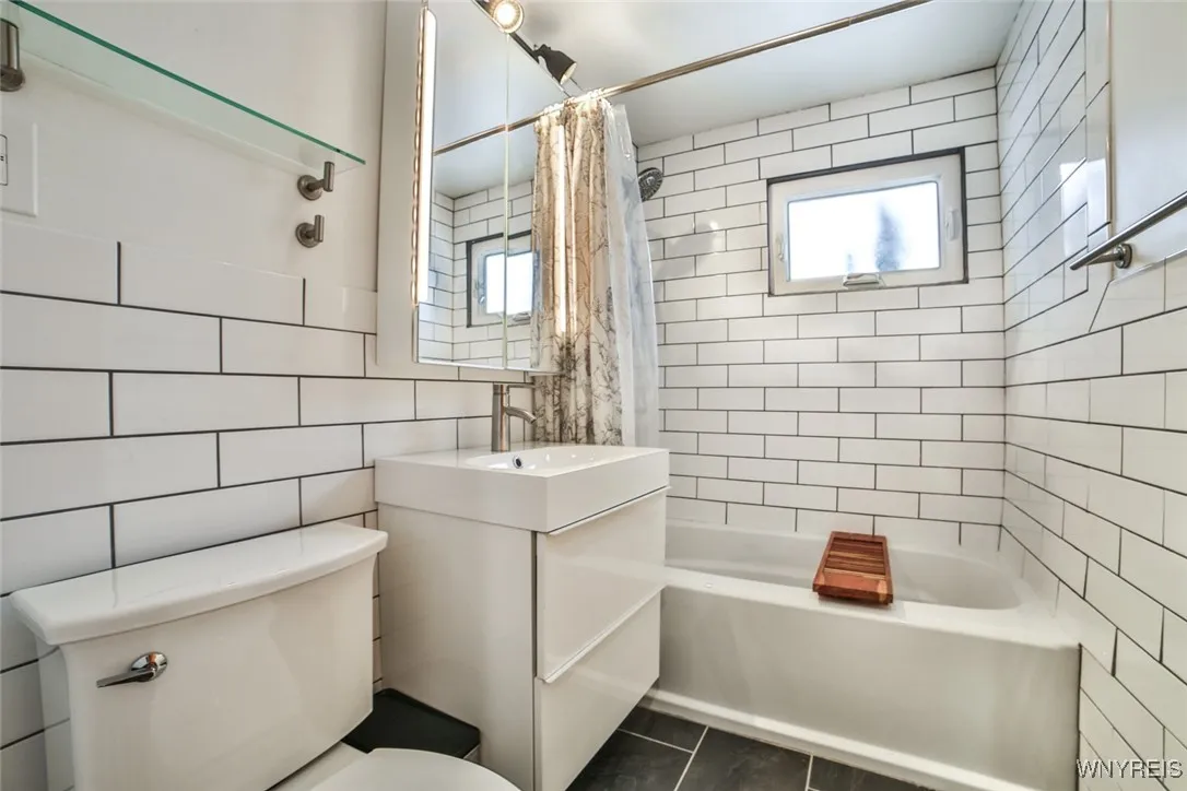 Fresh and updated, the bathroom offers heated floors for those chilly days.
