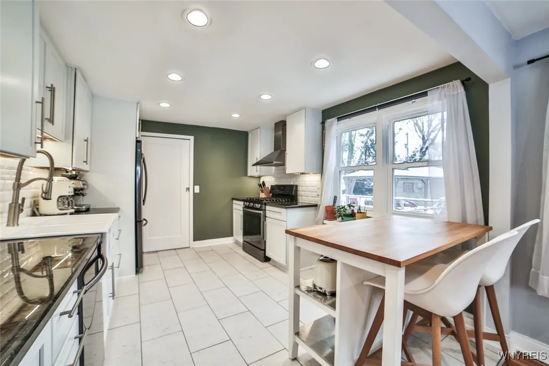 The island with storage and seating space will stay.