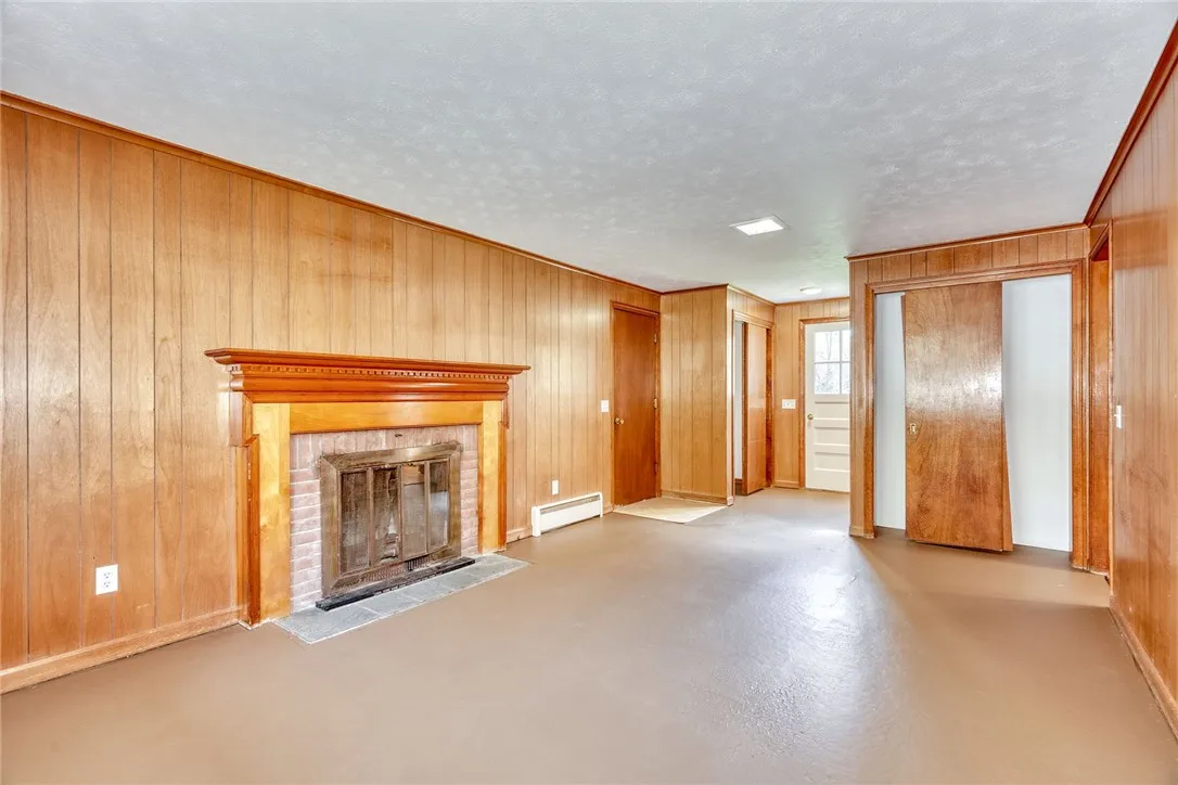 Family Room with wood burning fireplace (coveys as-is)