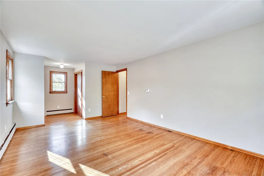 Primary Bedroom with hardwood floors and 2 closets!
