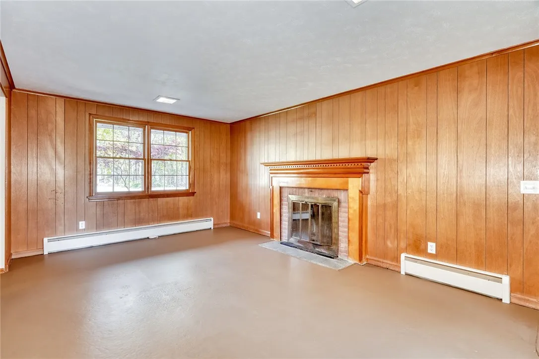 Family Room with wood burning fireplace (coveys as-is)