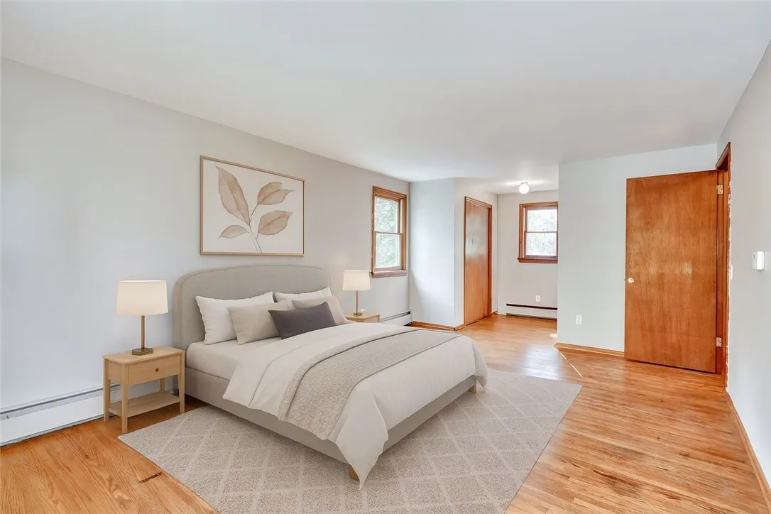 *VIRTUALLY STAGED* Primary Bedroom with hardwood floors and 2 closets!