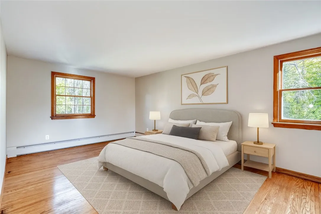 *VIRTUALLY STAGED * Primary Bedroom with hardwood floors and 2 closets!