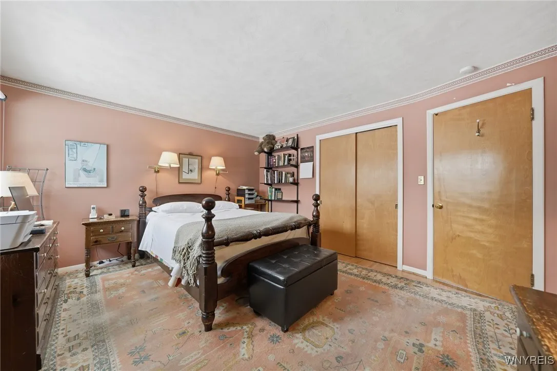 Primary bedroom with double closets & half bath access