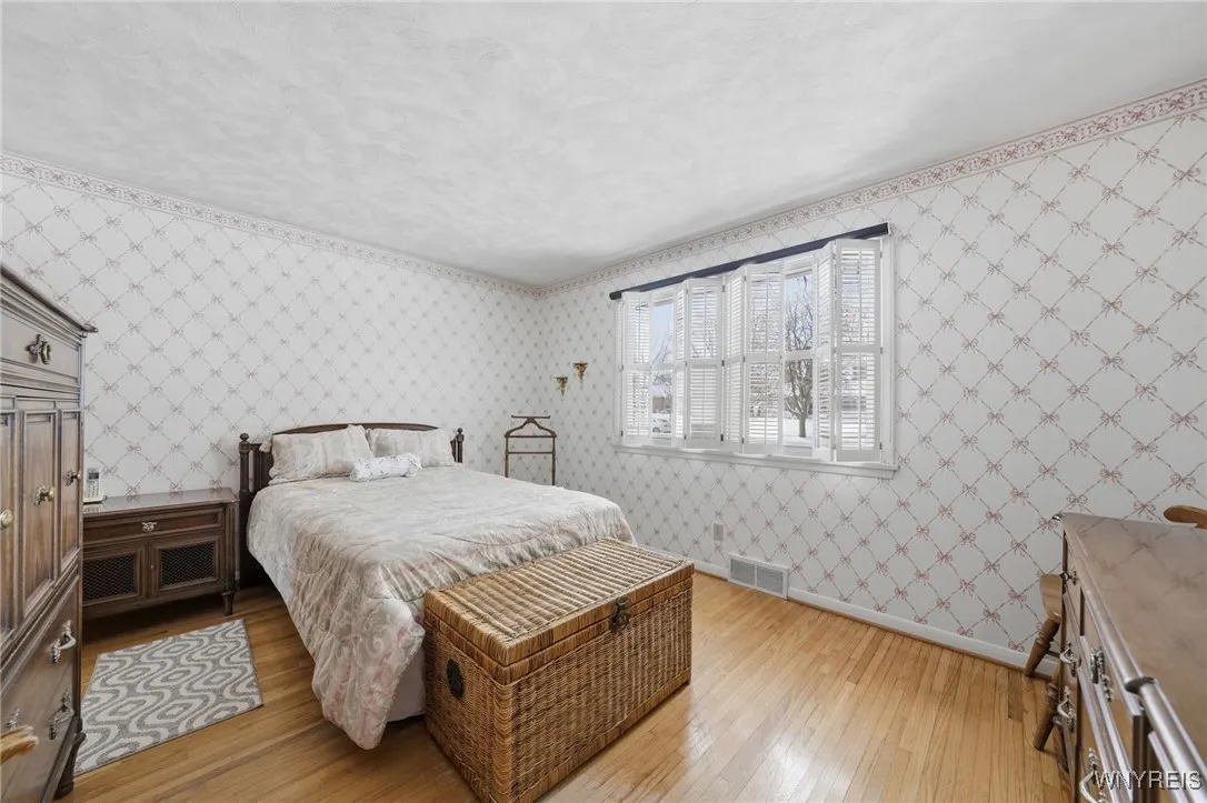 Primary bedroom with double closets & half bath access