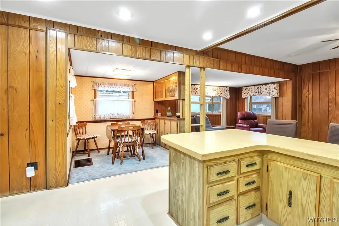 Kitchen dining area + unique room divider with storage cabinets