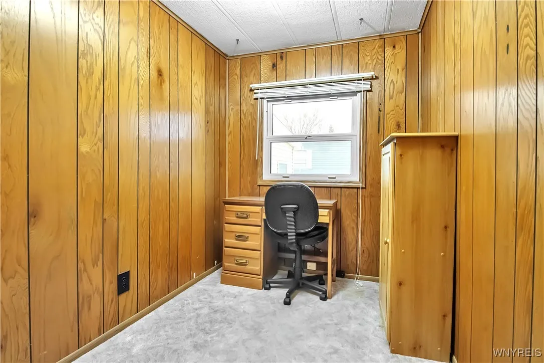 10x6 carpeted bedroom with ceiling light + double hung window with mini blinds