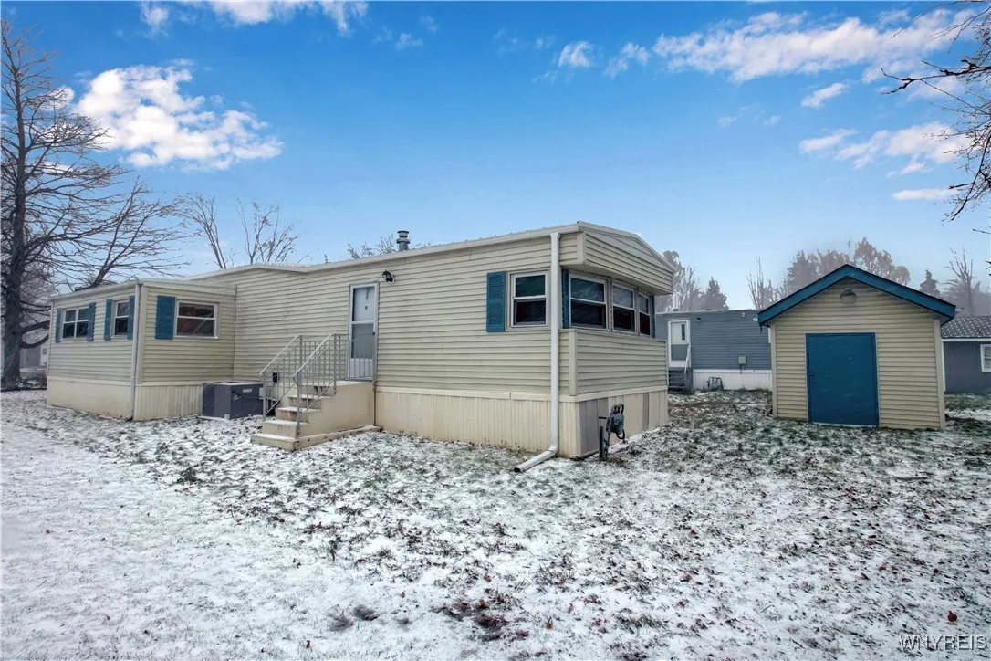 Side entrance + storage shed
