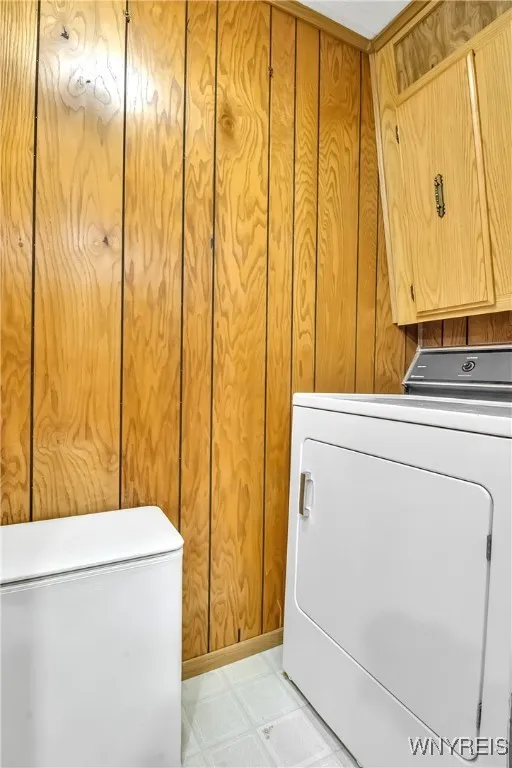 Laundry room with built-in storage cabinet + dryer