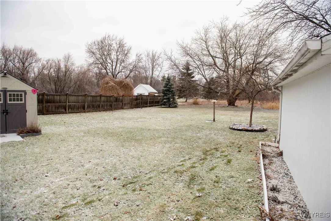DEEP YARD!!  TWO SHEDS - THE BIGGEST HAS A WORKBENCH INSIDE