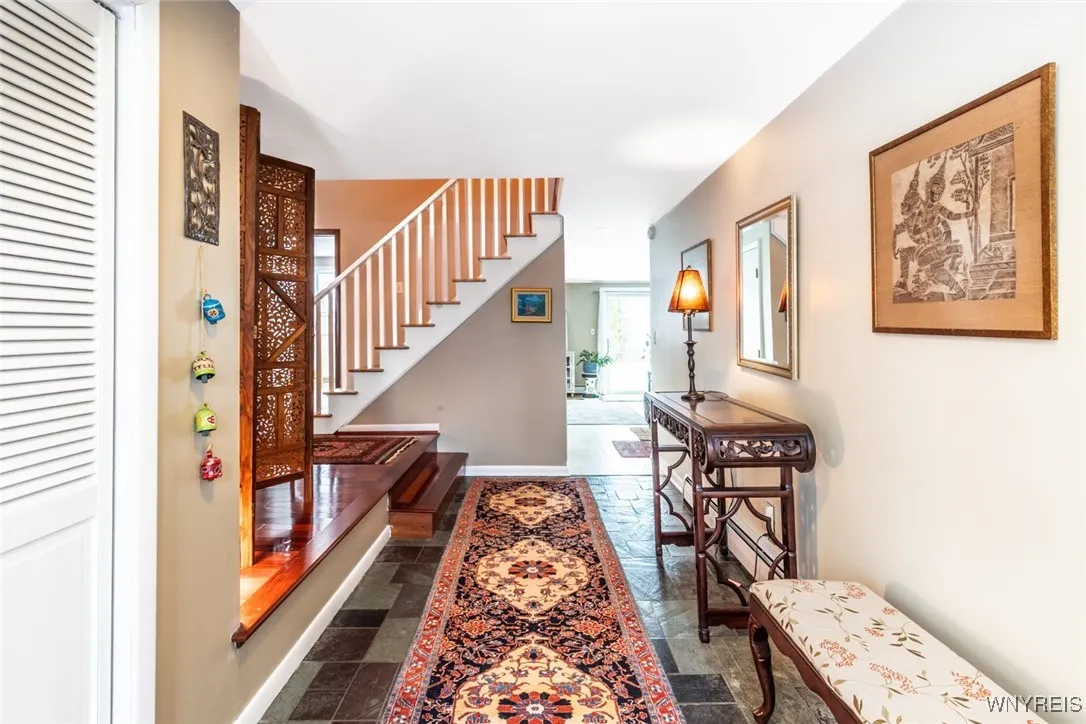 The generously sized front foyer flows to the family room ahead. Step up to the living room on the left.